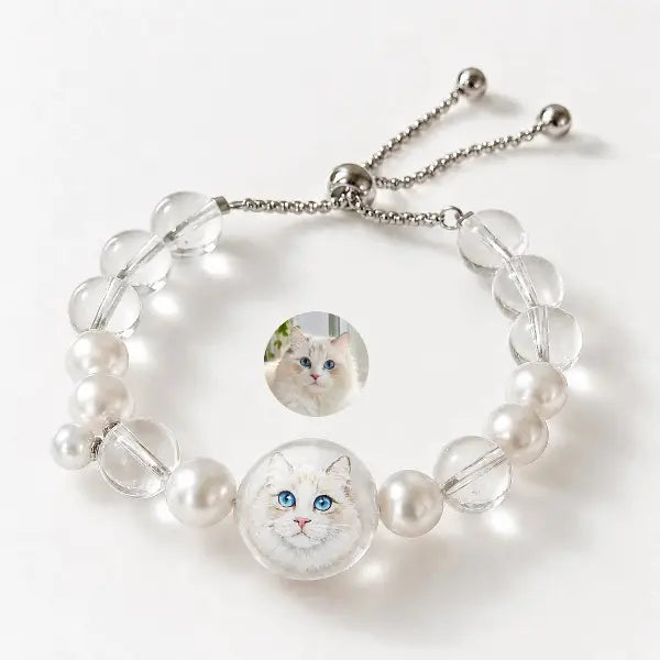 Handmade personalized cat portrait jewelry featuring custom painted Ragdoll cat charm, elegant clear crystal and pearl beaded adjustable bracelet gift for cat moms.