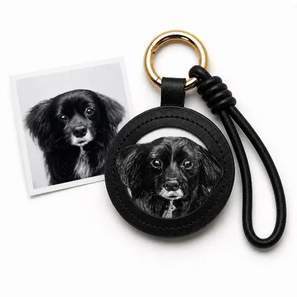 Handmade personalized dog portrait key ring displaying a premium black leather tag with a custom painted fluffy mixed breed dog replica, luxury gold hardware animal memorial gift.