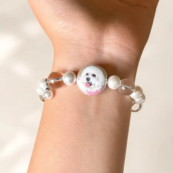 Personalized dog memorial bracelet featuring custom painted pet charm, unique handmade Maltese dog mom jewelry gift on wrist.