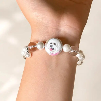 Personalized dog memorial bracelet featuring custom painted pet charm, unique handmade Maltese dog mom jewelry gift on wrist.