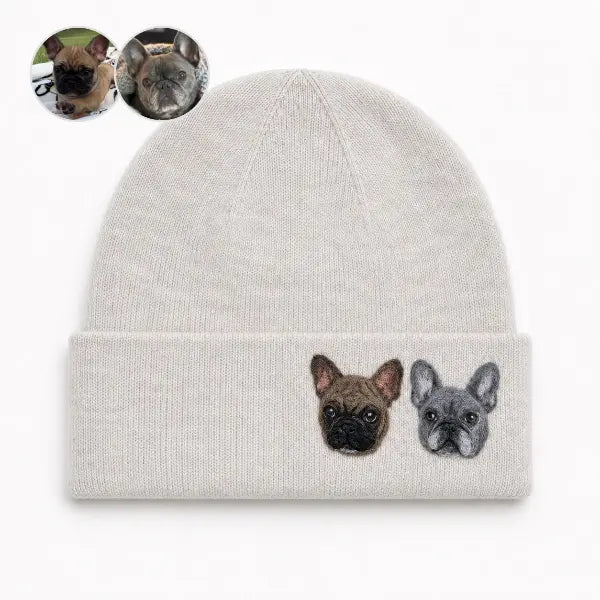 Custom two French Bulldogs photo to embroidered beanie comparison, featuring an off-white knit hat with personalized portraits of a fawn Frenchie and a blue French bulldog side-by-side matching the reference photos.