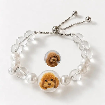 Handmade personalized dog portrait jewelry featuring custom painted red poodle charm, elegant clear crystal and pearl beaded adjustable bracelet gift for dog moms.