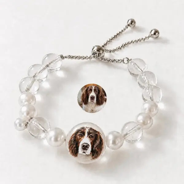 Handmade personalized dog portrait jewelry featuring custom painted Springer Spaniel charm, elegant clear crystal and pearl beaded adjustable bracelet for pet lovers.