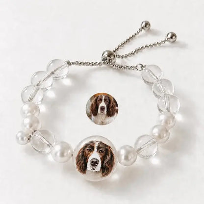 Handmade personalized dog portrait jewelry featuring custom painted Springer Spaniel charm, elegant clear crystal and pearl beaded adjustable bracelet for pet lovers.