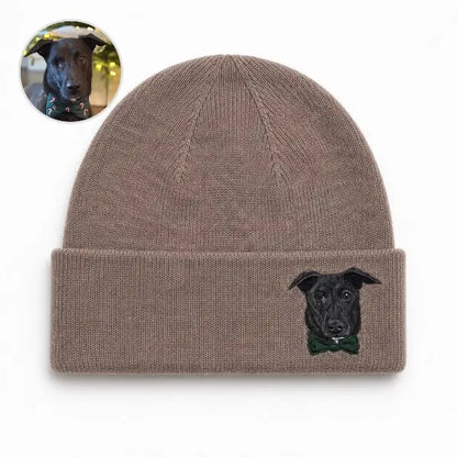 Custom dog photo to embroidered beanie comparison, featuring a mocha brown knit hat with a personalized portrait of a black Labrador mix wearing a dark green bow tie, matching the original reference photo.