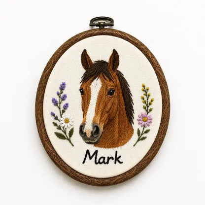 Custom horse photo to embroidery textile art in an oval wood grain hoop, showcasing a realistic stitched chestnut horse portrait with a distinctive white blaze marking on its face, named Mark.