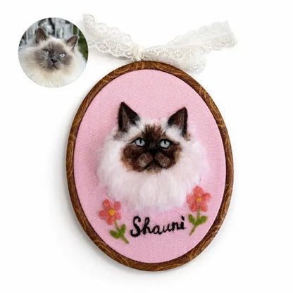 Custom cat photo to felt artwork comparison, showing a circular long-haired Siamese Balinese cat photo transformed into a handmade 3D needle-felted portrait with blue eyes in a wooden oval embroidery hoop.