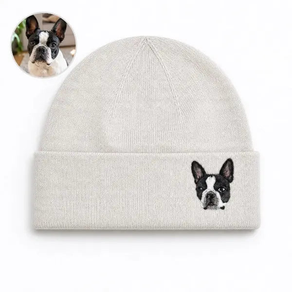 Custom dog photo to embroidered beanie comparison, featuring a off-white cuffed knit hat with a detailed realistic embroidered portrait of a black and white Boston Terrier based on the reference photo.