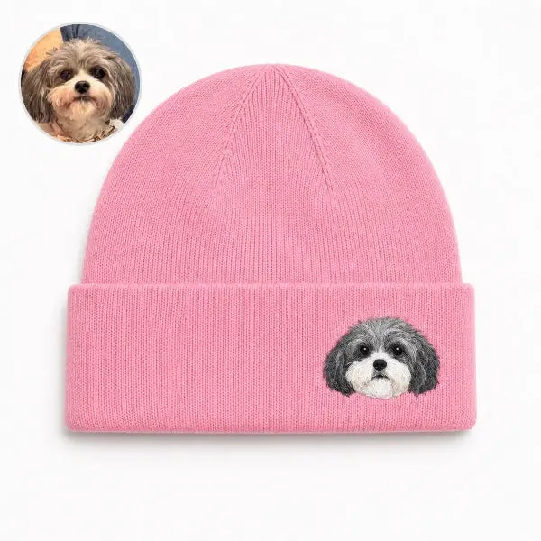 Custom dog photo to embroidered beanie comparison, featuring a bright pink knit hat with a detailed realistic embroidered portrait of a grey and white Havanese or Shih Tzu mix matching the reference photo.