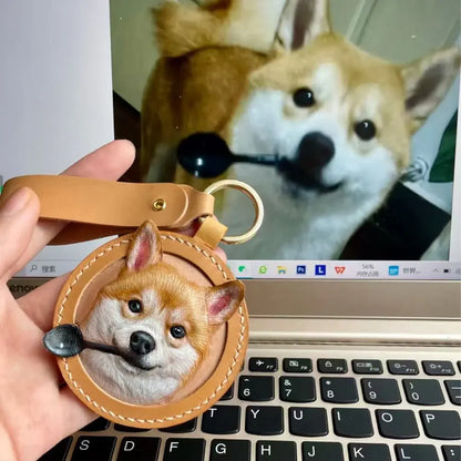 Hand-carved and painted leather Shiba Inu dog keychain, custom pet portrait leather bag charm showing comparison with real dog photo by Muse & Paw.